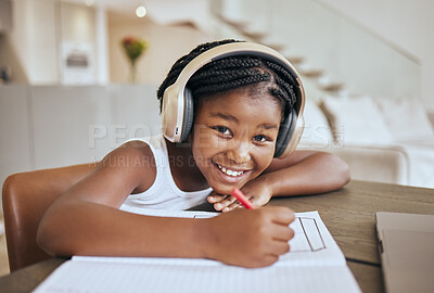 Buy stock photo Education, elearning and headphones of african child listening to audio translation, language learning and writing notes in book. Black girl kid at home with e learning, online education and portrait