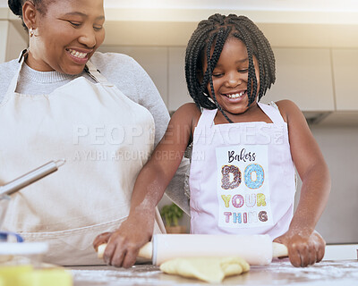 Buy stock photo Black woman, girl or bonding and baking in kitchen of house or family home with help, support or learning education with mom. Smile, happy and cooking child with mother and pastry for food or dessert