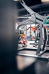 Gym interior, fitness and exercise with gym equipment and weightlifting for body training, health and wellness. Weights, muscle and strong for cardio and endurance with metal and steel for workout.
