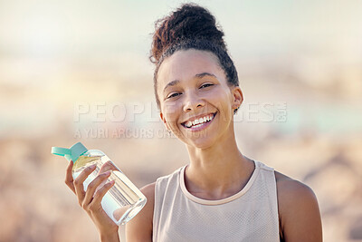 Buy stock photo Fitness, portrait and happy black woman after running, training and hiking exercise at a beach in summer. Smile, freedom and African girl with a water bottle for hydration or drinking water to relax