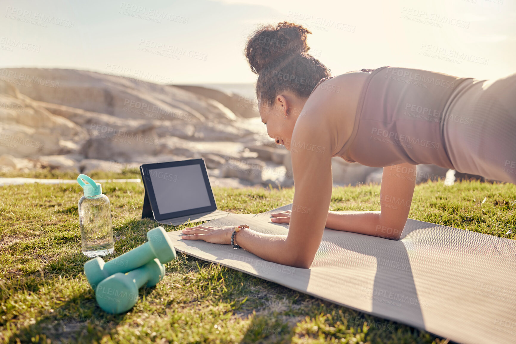 Buy stock photo Fitness, woman and tablet in yoga planking at the beach for exercise, training or workout in healthy wellness. Active female in plank pose for abdominal, abs or core strength with touchscreen outside