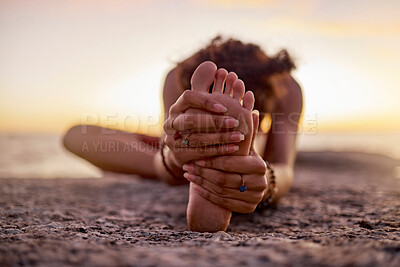 Buy stock photo Stretching, peace and feet of a woman on beach for yoga, training and exercise during sunset. Fitness, sand and legs of girl doing warm up before workout or pilates for wellness and relax by the sea