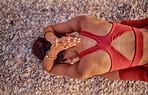 Meditation, yoga and top view of woman doing fitness, exercise and workout outdoors in nature. Training, pilates and aerial of back of black woman stretching on floor for wellness, calm and peace