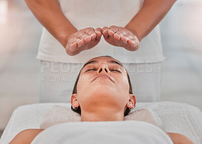 Relax, health and reiki with woman on spa table for healing energy, zen and alternative medicine. Peace, wellness and luxury with hands of massage therapist for holistic, chakra and spiritual detox