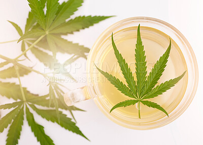 Buy stock photo Cannabis, marijuana plant and weed leaf in herbal tea, hot beverage or drink for health, wellness and relax. Healthcare, cbd and hemp for medical innovation with natural medicine for health benefits