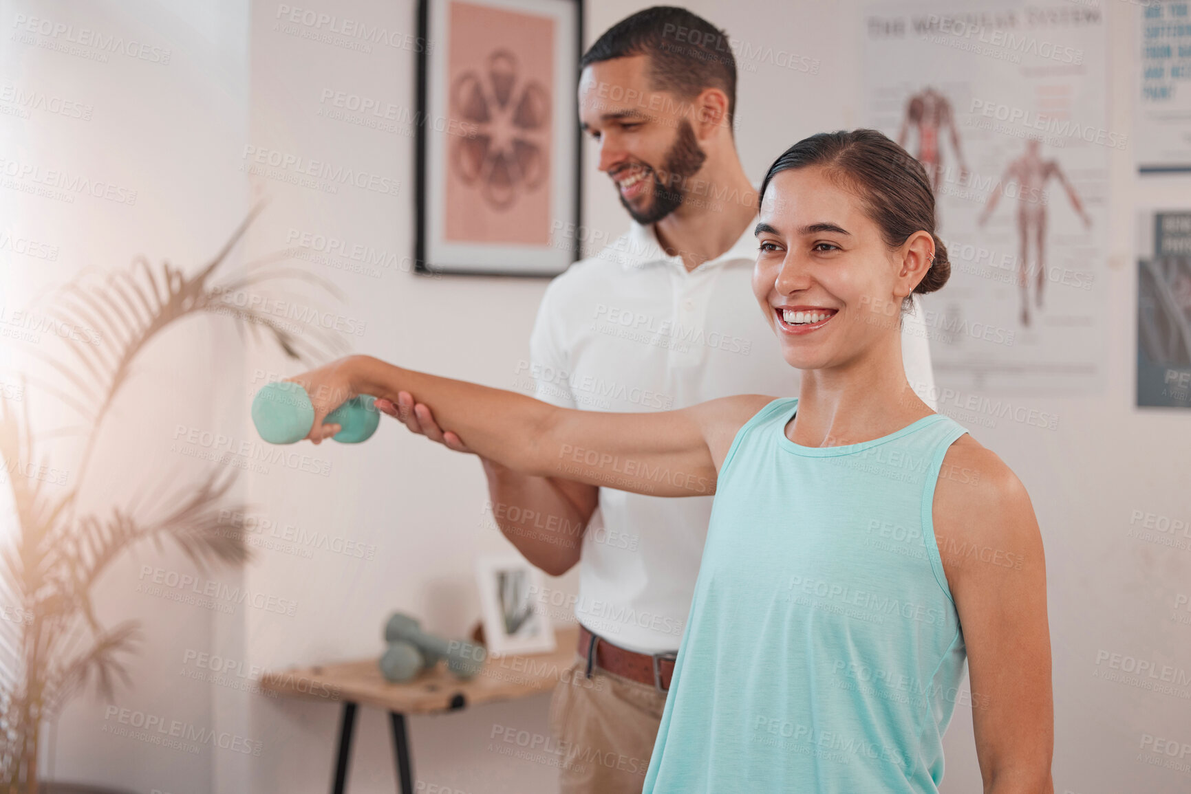 Buy stock photo Physiotherapy, dumbbell exercise and woman with doctor for rehabilitation, recovery or wellness after sports injury. Physical therapy, accident and man helping female patient with weight training.