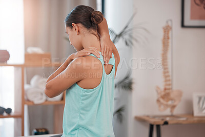 Buy stock photo Chiropractor, physiotherapy and injury with a woman client stretching in an office for movement or mobility. Rehabilitation, recovery and pain with a female patient at the physio for healing