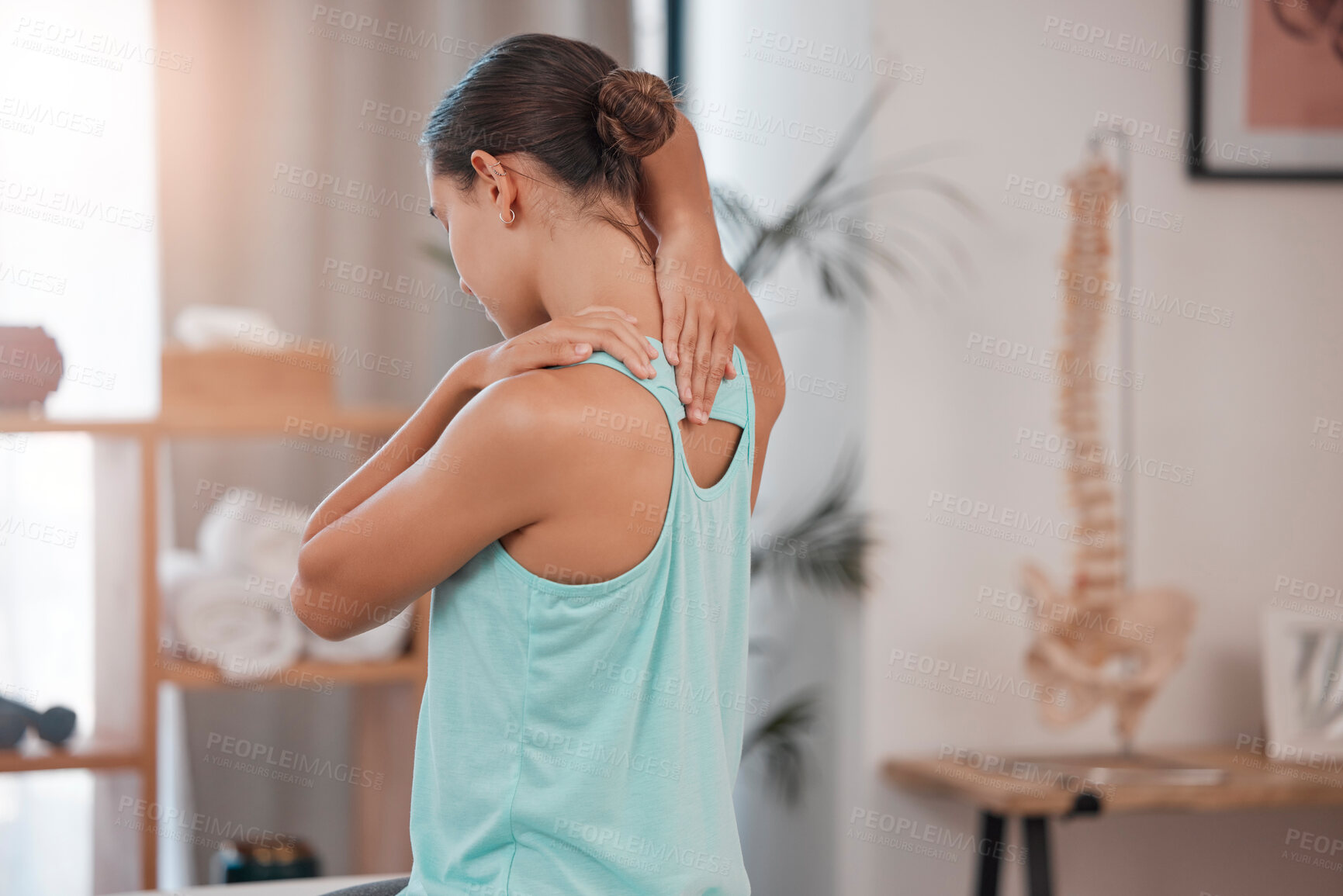 Buy stock photo Chiropractor, physiotherapy and injury with a woman client stretching in an office for movement or mobility. Rehabilitation, recovery and pain with a female patient at the physio for healing