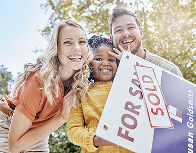 Buy stock photo Family, adoption and homeowner with a girl and foster parents holding a sold sign in their garden or yard. Portrait, diversity and love with a mother, father and daughter celebrating outdoor together