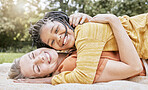 Happy family, mother hug and nature of a interracial girl and mama with love in a picnic park. Portrait of happy, relax and smile of a mother and daughter together on a floor with diversity adoption