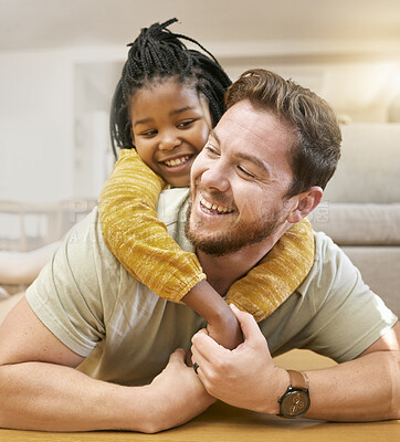 Buy stock photo Father and child hug with love while playing, happy together and care in family home living room. Man with girl smile, bonding and childhood with family and trust, spending quality time at home.
