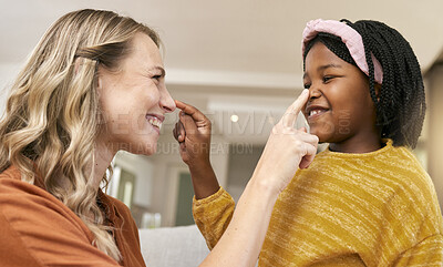 Buy stock photo Playful, adoption and mother with child during foster care, love and care in a house. Happy, smile and young African girl kid playing with her mom in an interracial family home with diversity