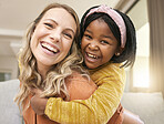 Portrait, love and family with an adopted girl and foster mother bonding in the living room of their home. Face, smile and piggyback with a woman and daughter in their house together with a smile