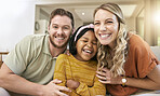 Family, adoption and happiness portrait with foster child, mother and father together for love, care and trust together on living room couch. Smile, support and laughing man, woman and girl bonding