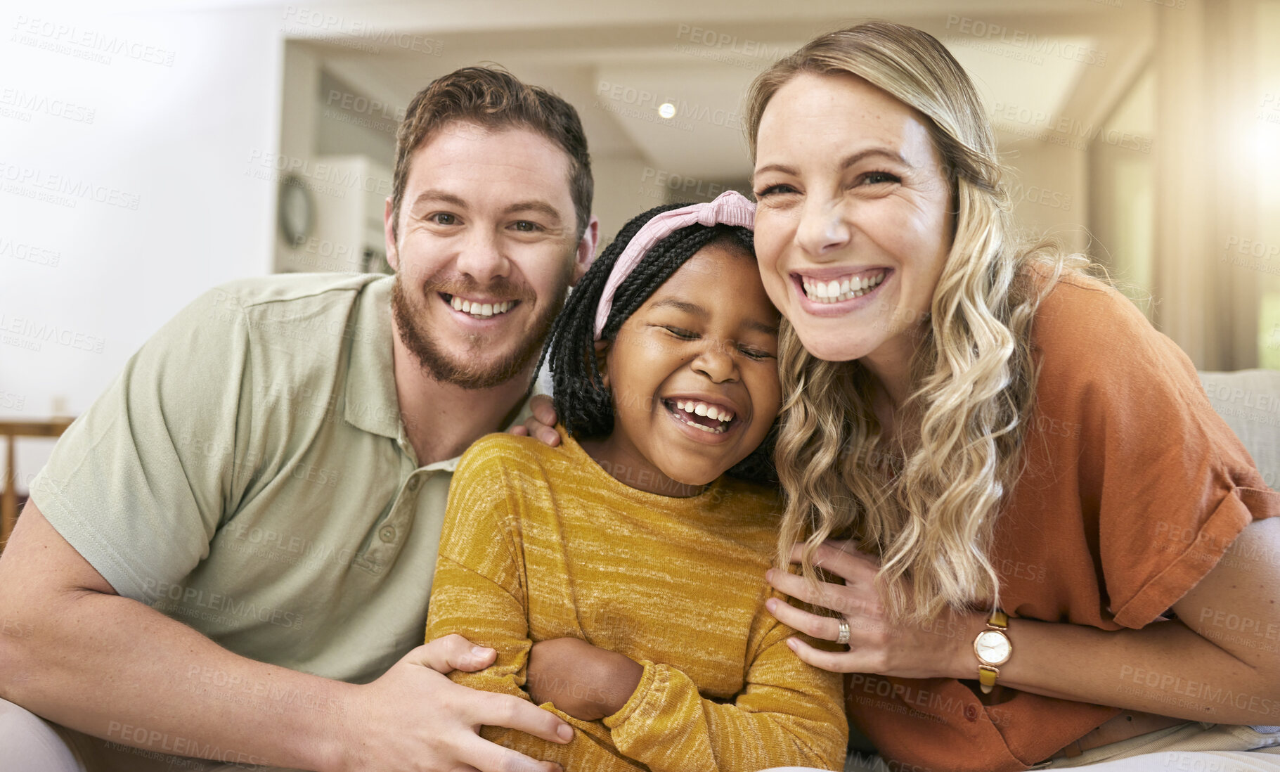 Buy stock photo Family, adoption and happiness portrait with foster child, mother and father together for love, care and trust together on living room couch. Smile, support and laughing man, woman and girl bonding