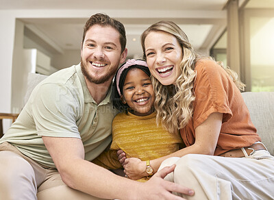 Buy stock photo Adoption, love and parents with a hug for child on the sofa in the living room of family home. Happy, care and portrait of African girl kid with affection from mother and father in interracial house