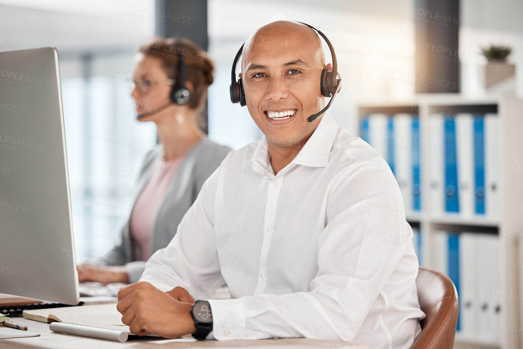 Buy stock photo Portrait, call center and customer service employee in office at desk with smile. Consultant, contact us or male sales agent, telemarketing or crm, help desk or support worker consulting in workplace