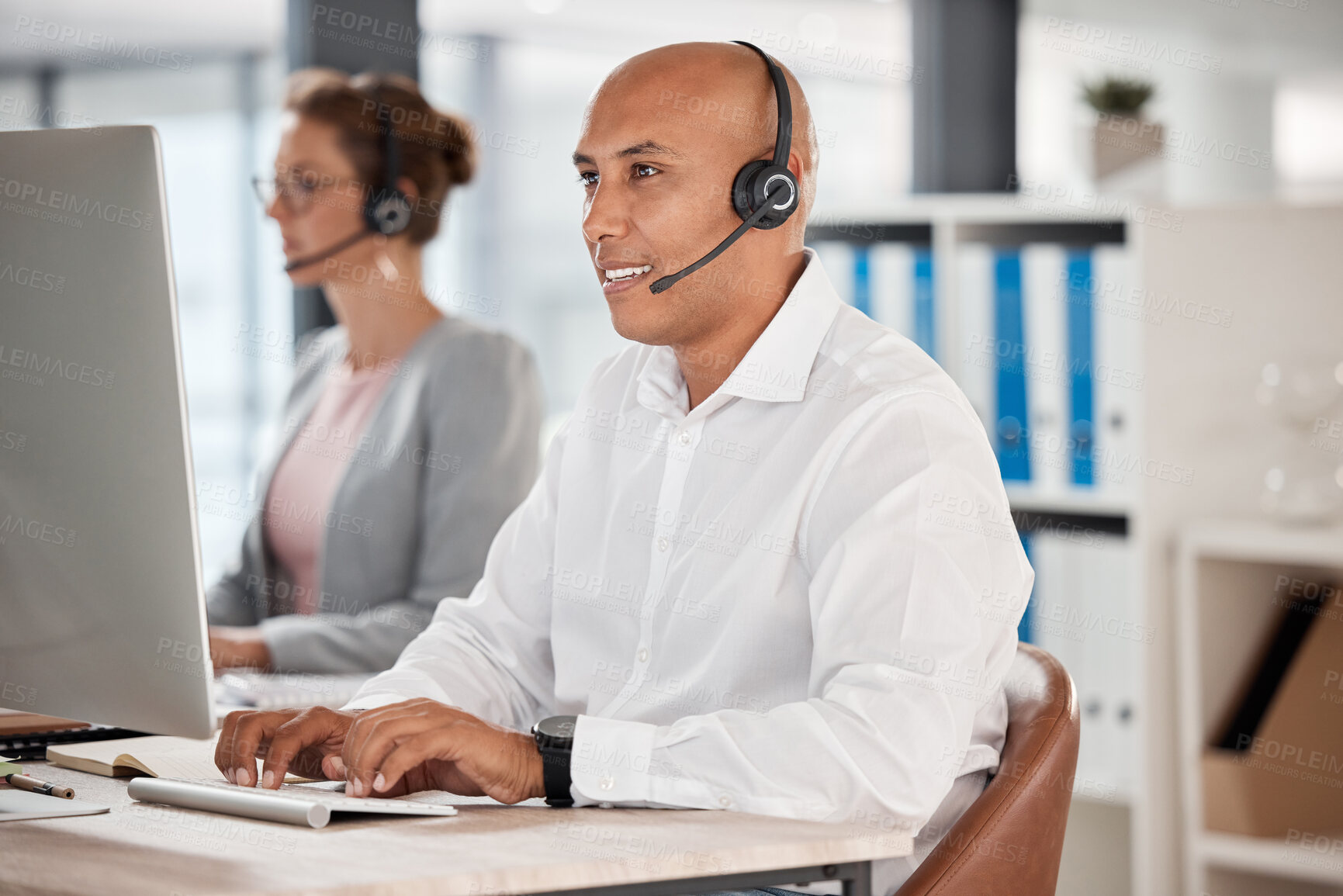 Buy stock photo Call center, customer service and support with a man consultant working on a computer in his sales office. Retail, ecommerce and communication with a male consulting using a headset for help