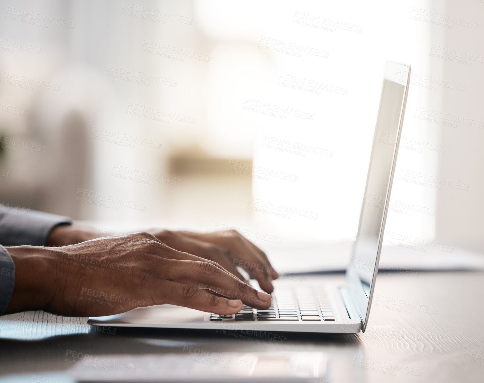 Buy stock photo Closeup, hands and typing on laptop with black man at desk for email, communication or digital marketing in office. Zoom, businessman hand and keyboard on computer for strategy, planning or research