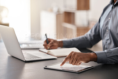 Buy stock photo Tablet, laptop and hands of businessman writing notes in a notebook doing corporate research in modern office. Technology, professional and closeup of manager working on online project in workplace.