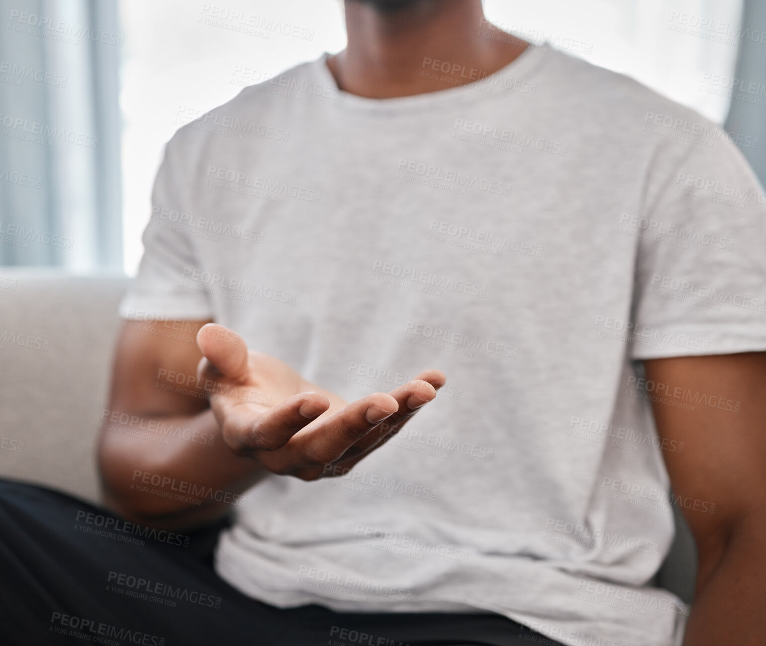 Buy stock photo Marketing, product placement and hands of a man advertising with palm on the sofa in a house lounge. Branding, logo and hand of a person to show a product in space while on the living room couch