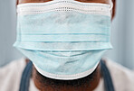 Covid, healthcare and closeup of face mask on black man for safety, wellness and global virus protection. Medical, breathing and caution with ppe and guy for compliance, insurance and pandemic risk