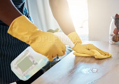 Buy stock photo Hands, hygiene and detergent for clean table, domestic or sanitary for bacteria or dirt removal at home. Hand of health worker cleaning desk with chemical spray bottle and cloth for safety from germs