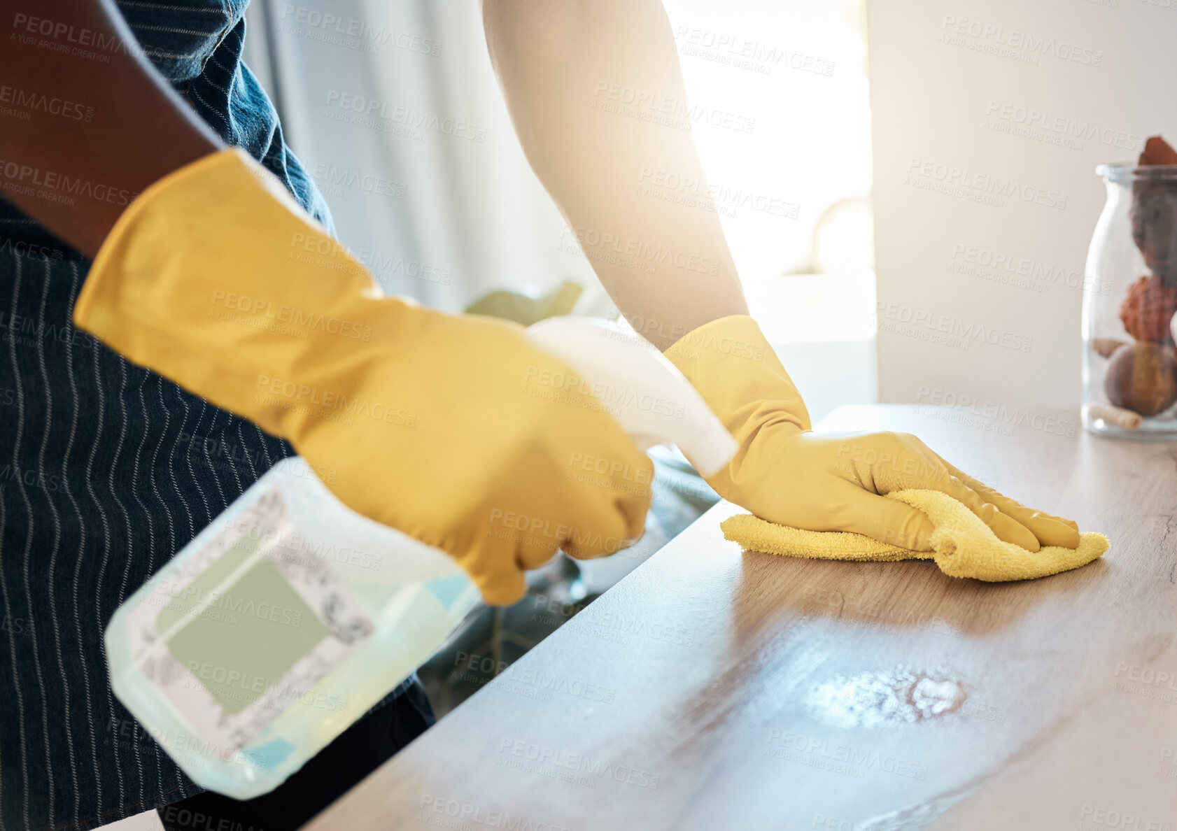 Buy stock photo Hands, hygiene and detergent for clean table, domestic or sanitary for bacteria or dirt removal at home. Hand of health worker cleaning desk with chemical spray bottle and cloth for safety from germs