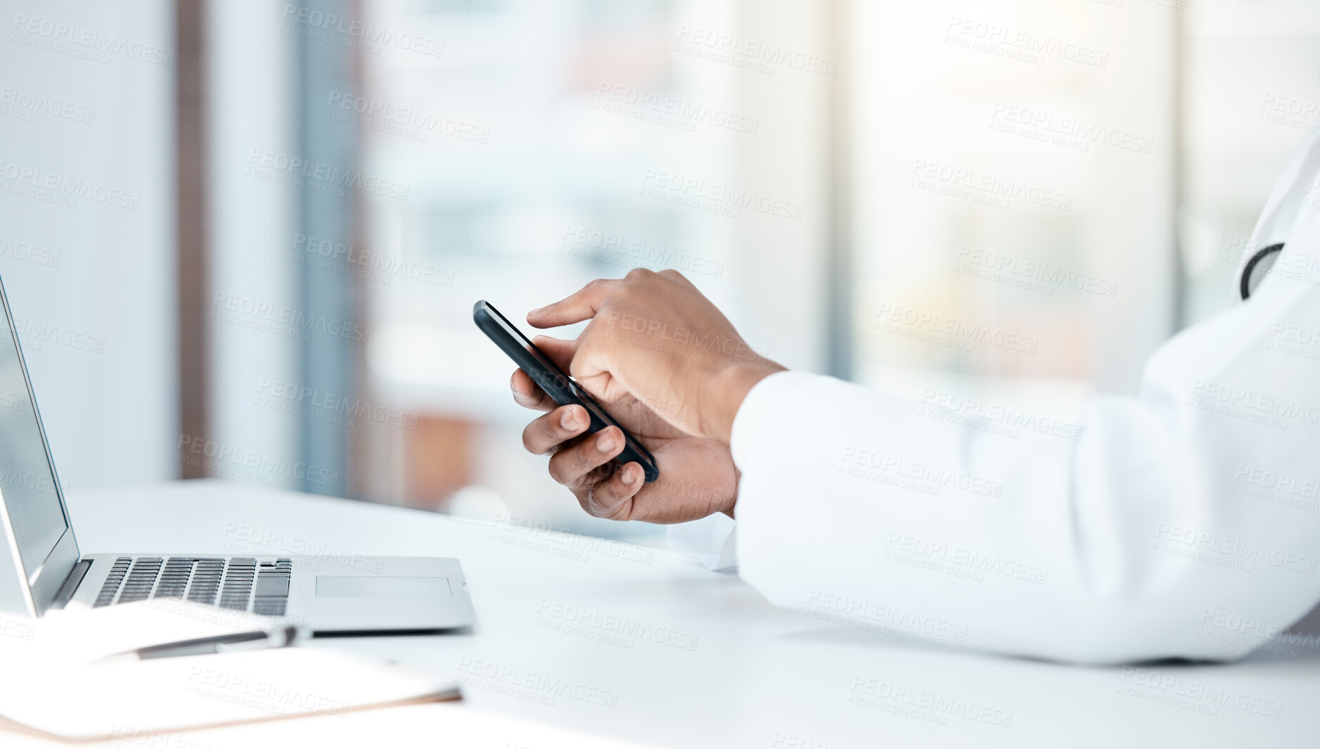 Buy stock photo doctor, laptop and hands with phone for online communication in hospital office. Man, healthcare innovation and medical science doctor or cardiology research on internet tech mobile smartphone