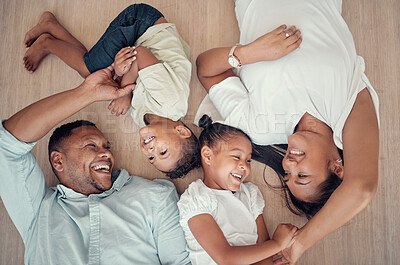 Buy stock photo Top view, happy family or bonding on floor in house living room, family home bedroom or Indonesian hotel. Smile, children or kids with mother, father or parents lying on ground in trust, play or love