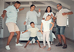 Big family, fun and dance to music in the living room in home, happy and smile together. Children, grandparents or parents dancing, love or crazy people enjoy bonding, audio and relationship in house