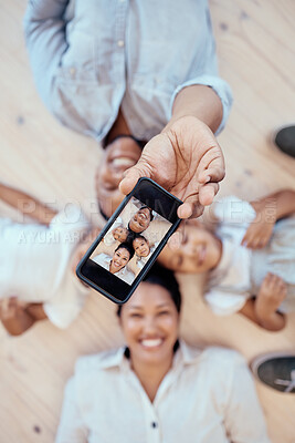 Buy stock photo Top view, family and phone selfie in home for happy memory together on floor. Love, care and 5g mobile picture of happy mother, father and children bonding for social media, internet or online post.