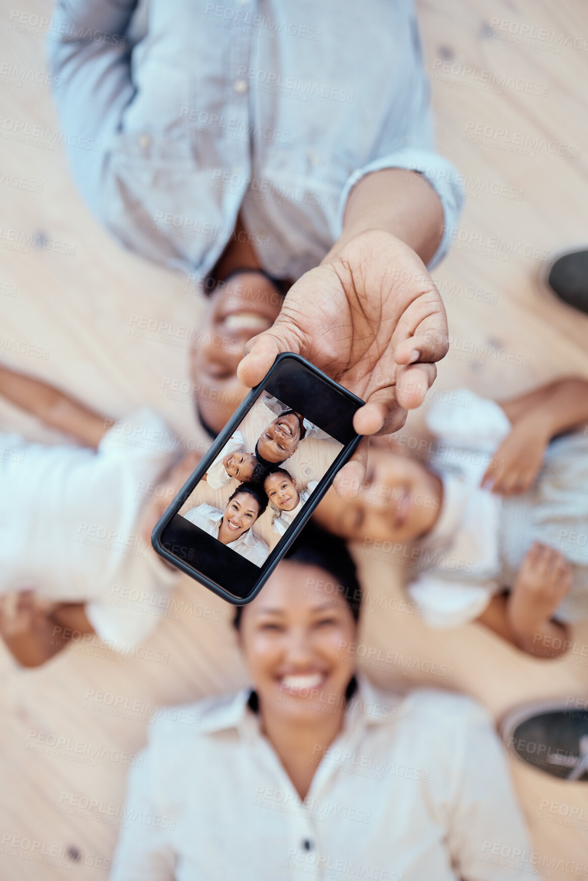 Buy stock photo Top view, family and phone selfie in home for happy memory together on floor. Love, care and 5g mobile picture of happy mother, father and children bonding for social media, internet or online post.