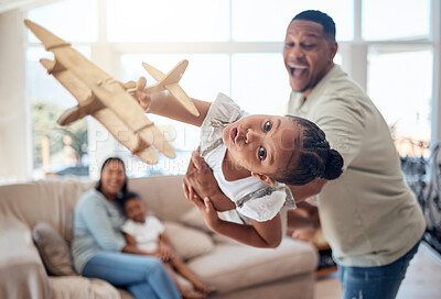 Buy stock photo Father, girl or playing with toy airplane in family home or house living room for exciting game, travel dreams or fantasy. Playful portrait, plane or fun child bonding with man, dad or lifting parent