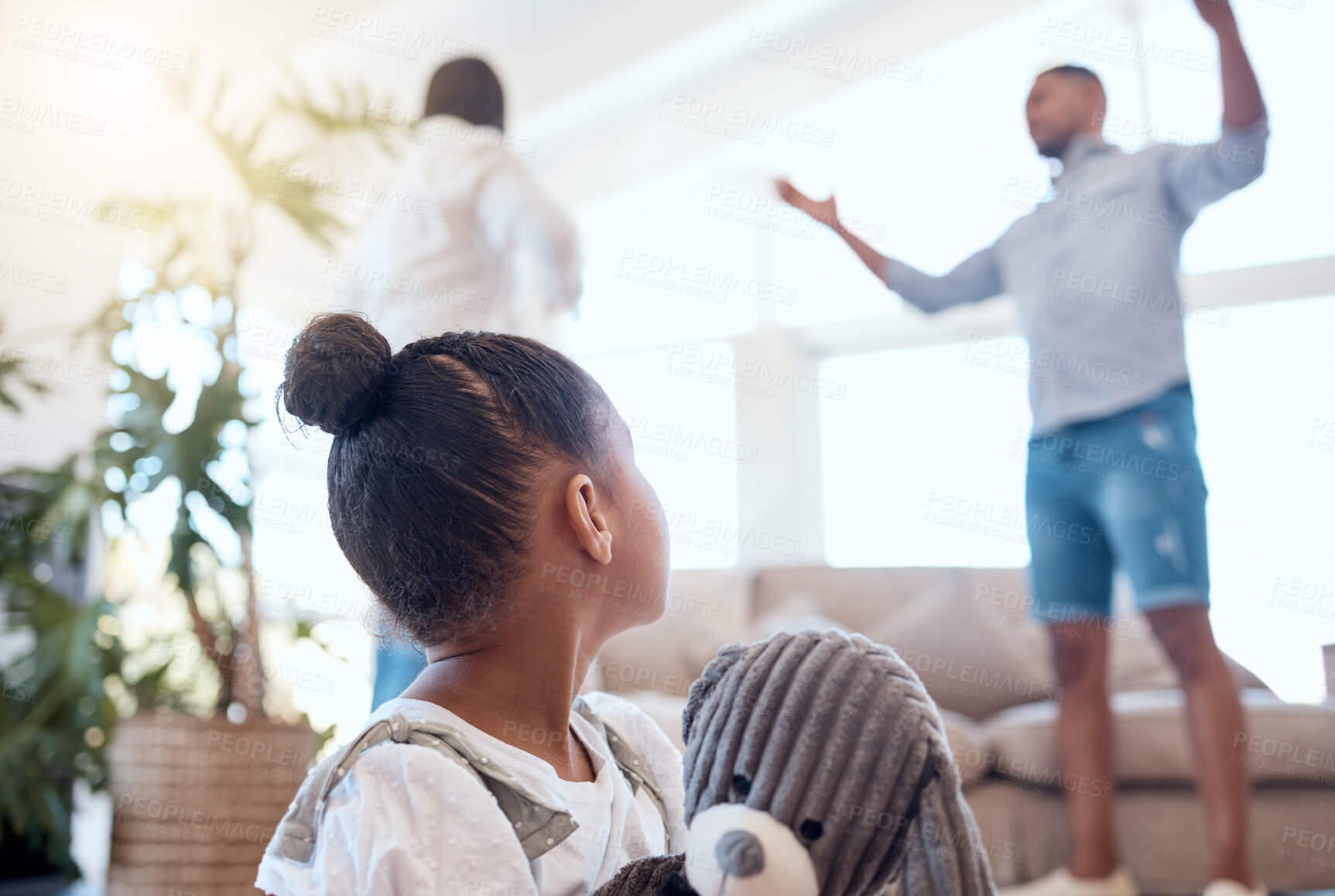 Buy stock photo Argument, divorce and scared child in the living room with a teddy bear for comfort in a modern house. Family, break up and parents fighting with disagreement in front of girl kid in lounge at a home