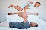 Happy, airplane and father with child in bedroom for relax, support and bonding together. Smile, balance and games with dad playing with son in family home for freedom, funny and affectionate