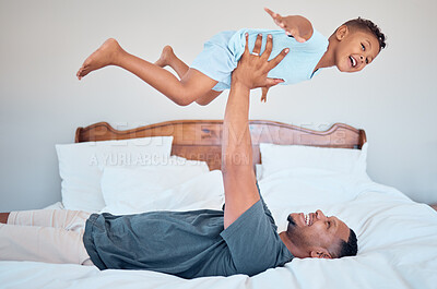 Buy stock photo Happy, airplane and father with child in bedroom for relax, support and bonding together. Smile, balance and games with dad playing with son in family home for freedom, funny and affectionate