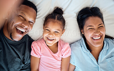 Buy stock photo Relax, happy and selfie with family in bedroom for wake up, smile and bonding in the morning. Funny, support and care with parents and girl at home for weekend, happiness and affection together