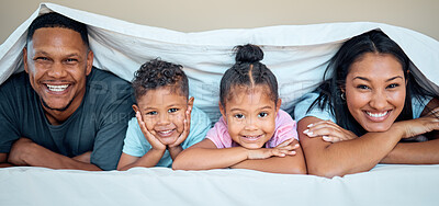 Buy stock photo Love, bed and portrait of family with blanket spending quality time, bonding and having fun on weekend. Happiness, black family and mother with dad and children posing in bedroom to relax in morning