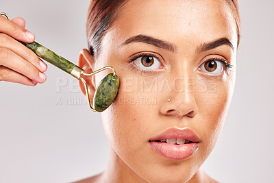 Buy stock photo Face roller, skincare and black woman portrait of a model with facial, luxury and massage product. Beauty, skin wellness and dermatology treatment for healthy body glow with natural jade stone 