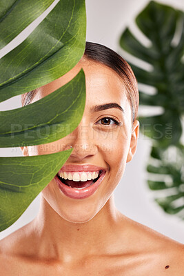 Buy stock photo Skincare, beauty and portrait of woman with plant in studio for wellness, luxury and spa. Body care, makeup and girl with smile on face for natural beauty products, cosmetics and skincare products