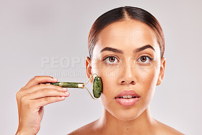 Buy stock photo Beauty, skincare and jade roller with portrait of woman for facial massage, self care and spa wellness mockup. Cosmetics, health and dermatology with girl model for cosmetology, youth and luxury