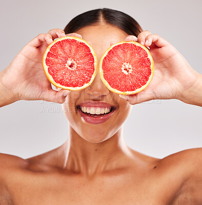 Buy stock photo Grapefruit, skincare and wellness of a woman holding fruit, skincare and vitamin c for face glow. Model with fruits for health, cosmetic eye treatment and healthy diet nutrition food with beauty