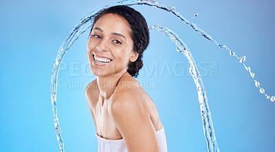 Buy stock photo Beauty, splash and black woman in studio portrait for cleaning body or skincare promotion with water on blue mockup. Face, skin care model with water drops or shower in bathroom for morning facial