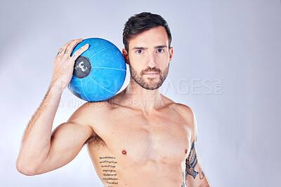 Buy stock photo Man, basketball and sport with ball, tattoo and body against a grey studio background with mockup space. Male model, athlete and sports person with portrait, training and fitness after game practice