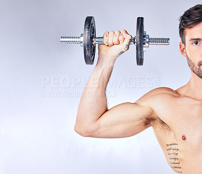 Buy stock photo Dumbbell, exercise and portrait of man in studio isolated on a gray background. Workout, health and bodybuilder or fitness model weightlifting, exercising and training for muscle or strength mock up.