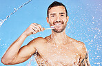 Man, toothbrush and smile for dental care, hygiene and cosmetics against an aqua blue studio background. Portrait of happy male smiling with teeth for clean oral wash, mouth or gum care treatment