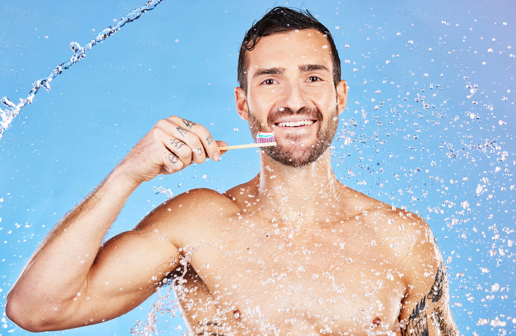 Buy stock photo Man, toothbrush and smile for dental care, hygiene and cosmetics against an aqua blue studio background. Portrait of happy male smiling with teeth for clean oral wash, mouth or gum care treatment