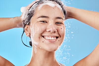 Buy stock photo Hair shampoo, portrait and woman in shower in studio isolated on a blue background. Hygiene, water splash and healthy female model from Canada cleaning, bathing and washing for wellness and hair care