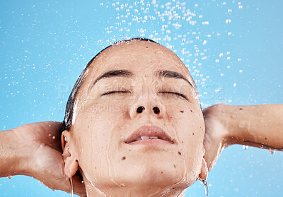 Buy stock photo Face, skincare and woman in shower in studio isolated on blue background. Hygiene, water splash or healthy female model from Canada cleaning, bathing and washing for body care, beauty or wellness


 